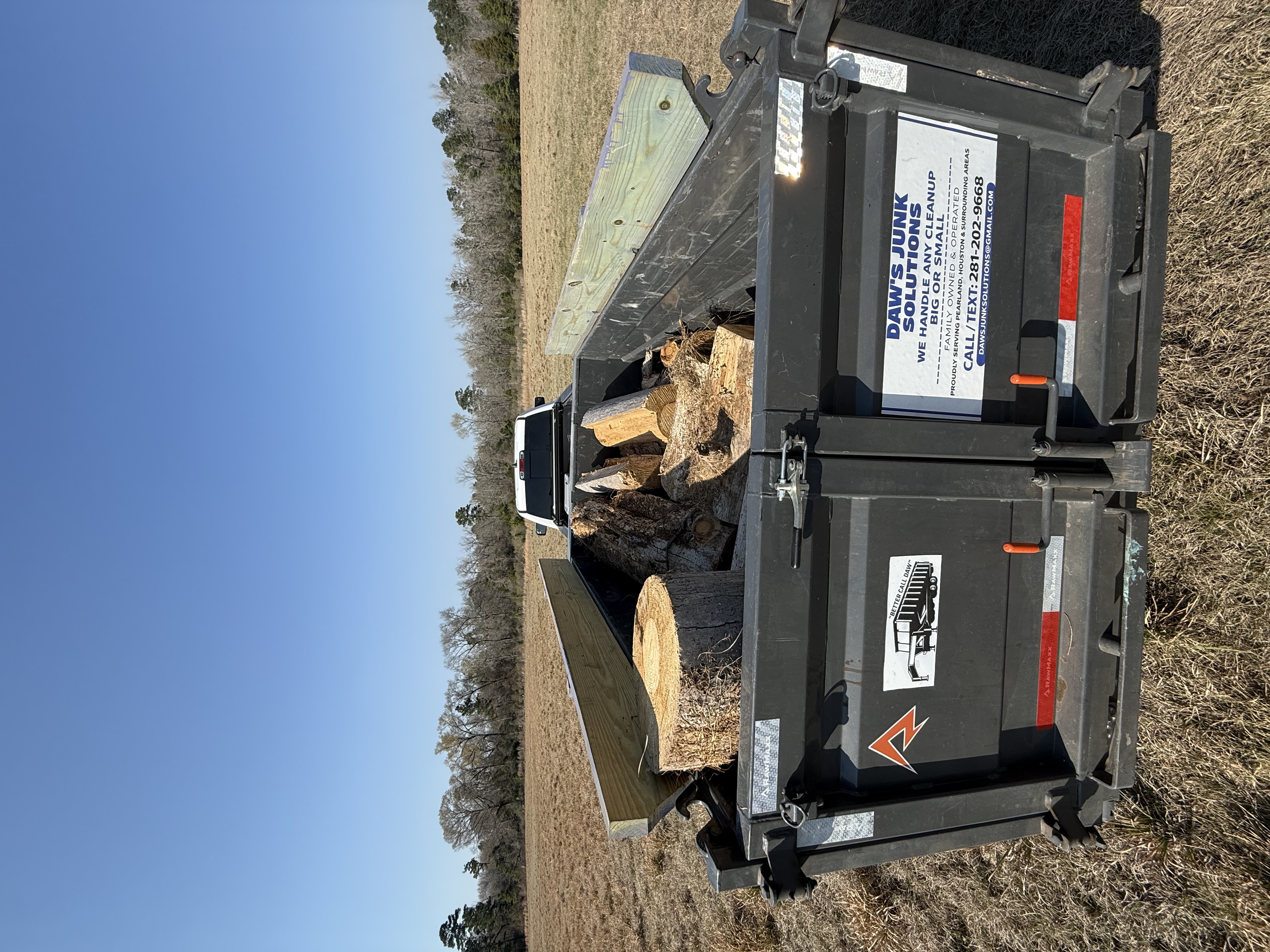 Yard waste and tree debris removal — Daw's RawMaxx trailer loaded with logs