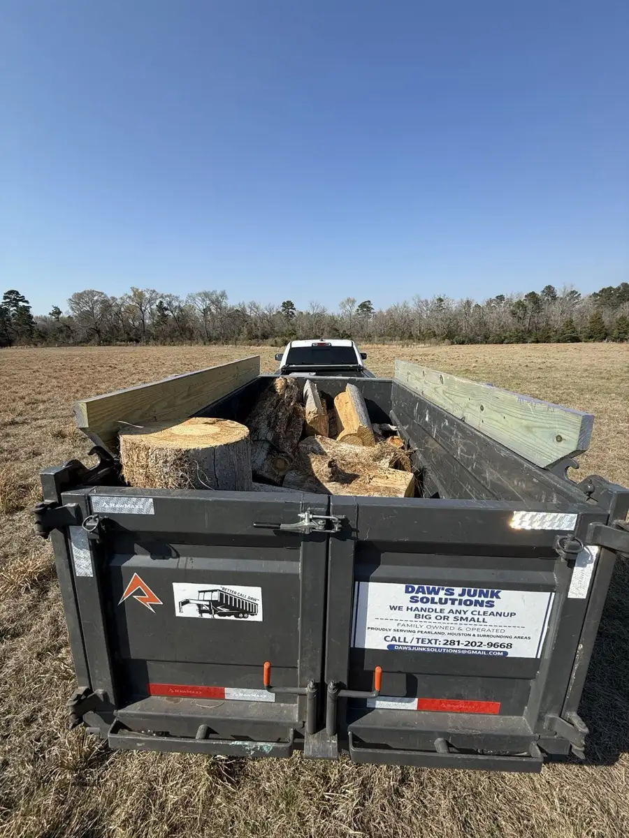 Yard waste and tree debris removal, Daw's RawMaxx trailer loaded with logs